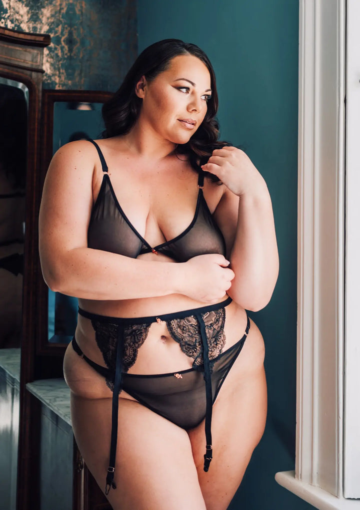 Woman wearing a Black Mesh Triangle Lingerie Set